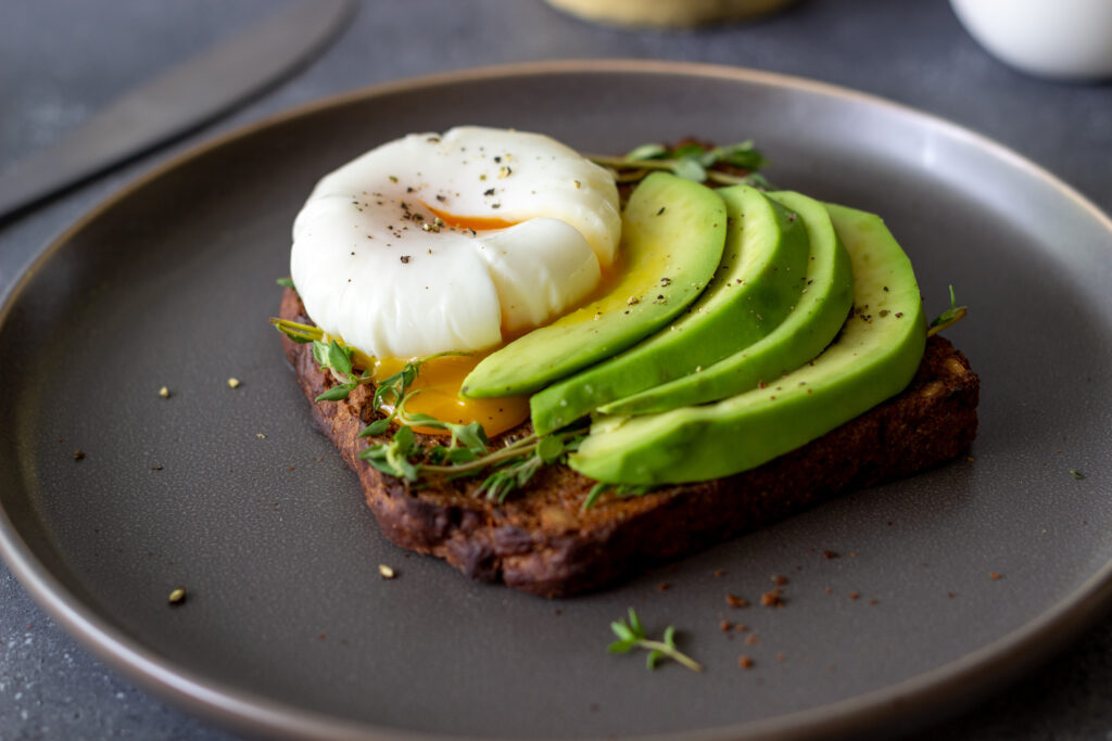 Sandwich with avocado and poached egg. Healthy eating Vegetarian food. Breakfast