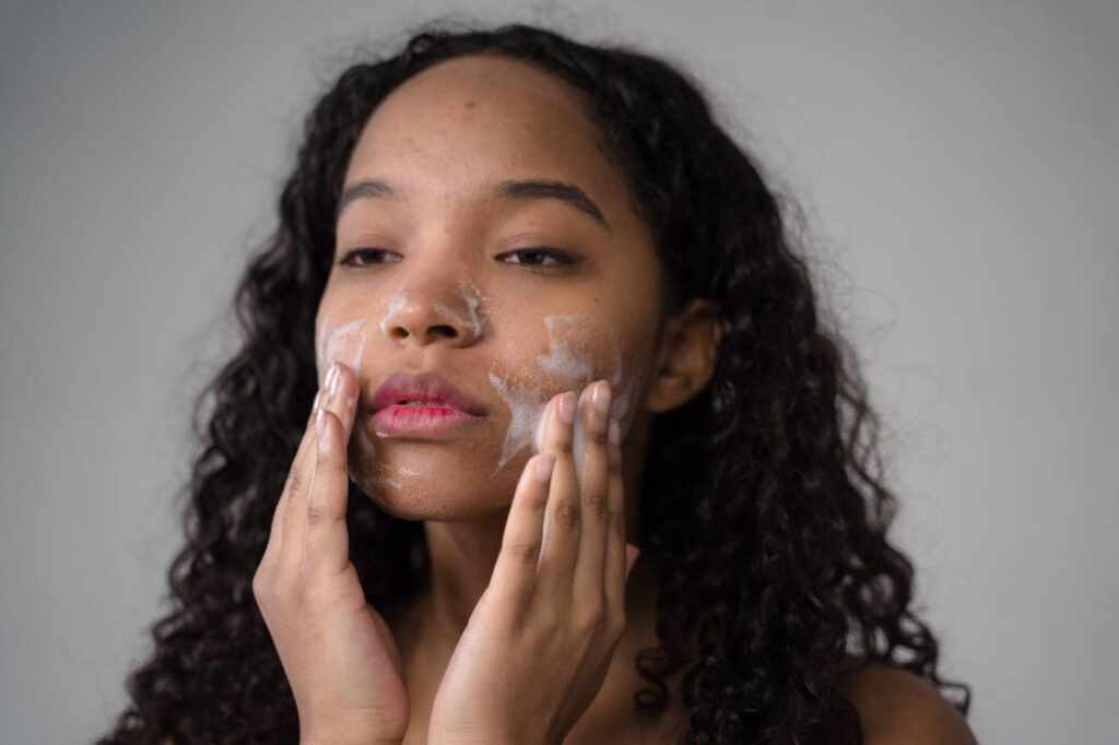 Photo by Ron Lach : https://www.pexels.com/photo/african-american-young-girl-washing-face-with-facial-foam-9246304/