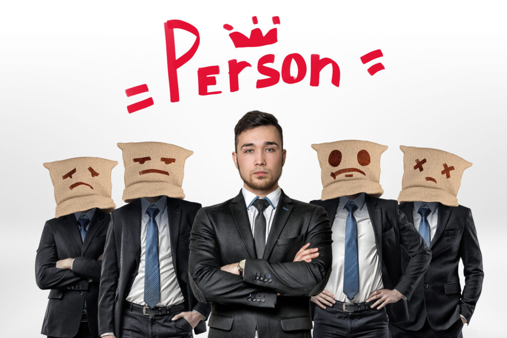 Businessman and four people with jute bags on their heads with the word Person and a crown above on white background