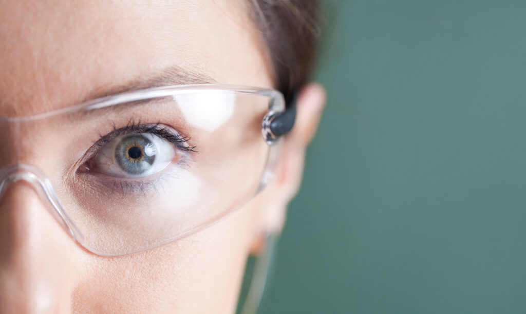 Young woman looking at virtual graphics