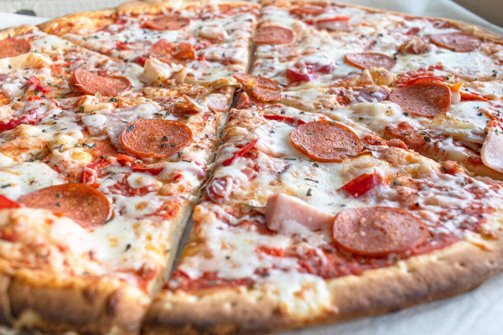 Close Up of Tasty Hot Pizza with Bacon, 