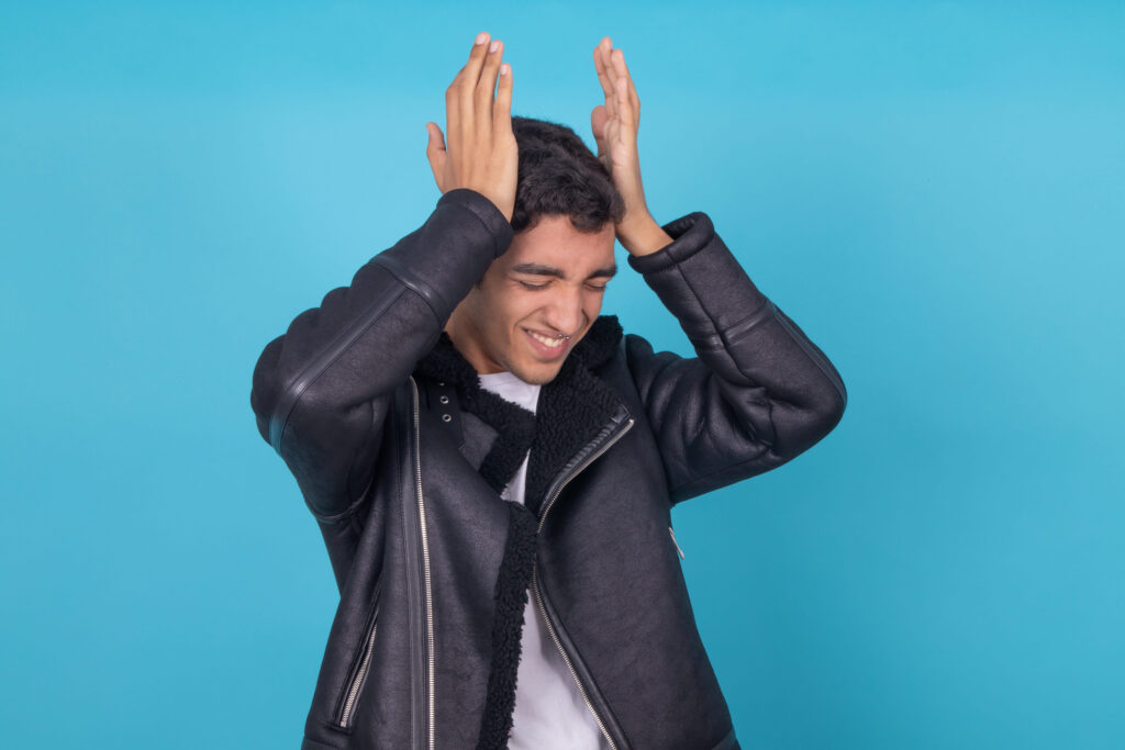 young expressive male model isolated on color background