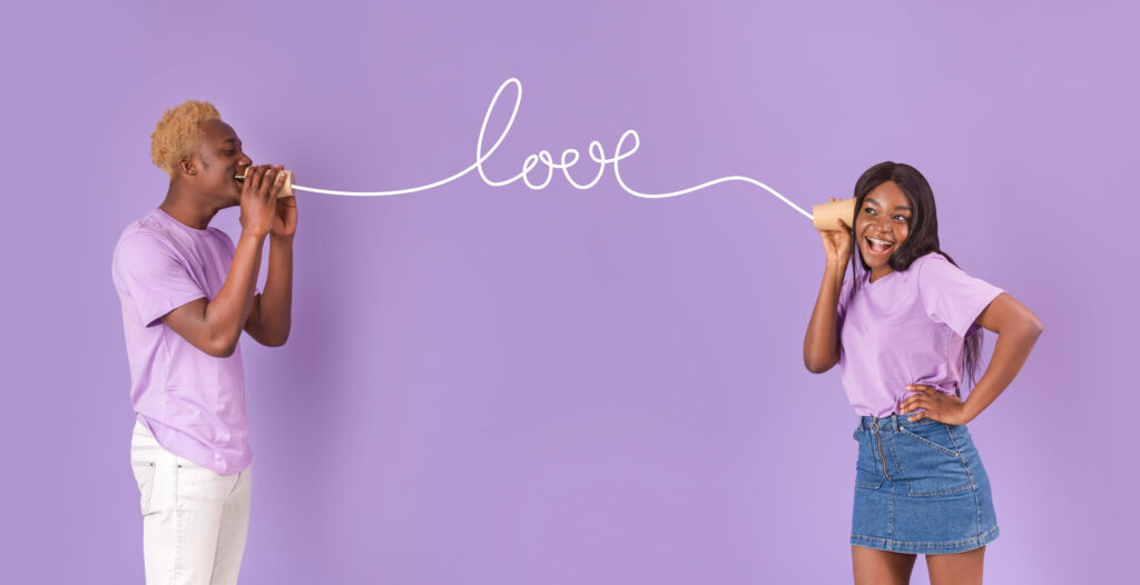 Millennial black couple sending each other love message through tin can phone, lilac background. Panorama