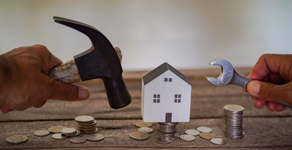 Home model on the stacked coin with many increase and grow value in the public park, financial of real estate business investment and save money for buy house concept.