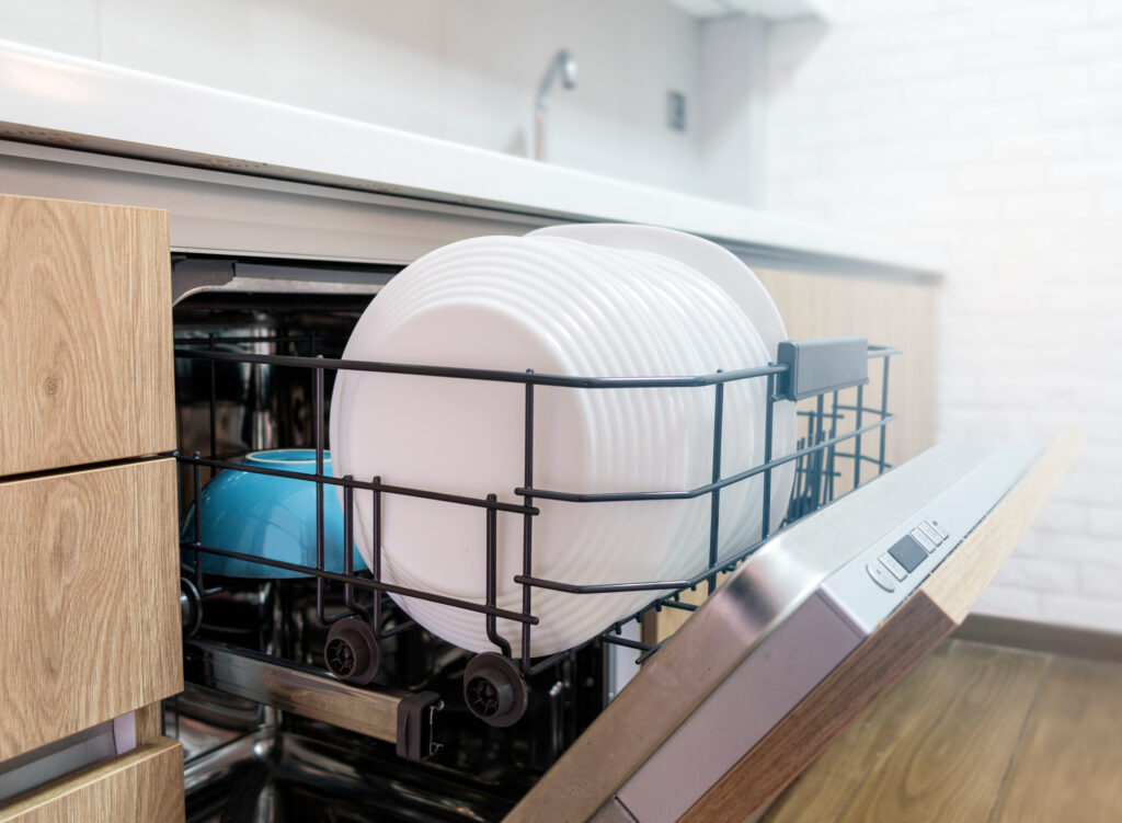 7 Household Appliances Secretly Bleeding You Dry Through Water Waste 2 Opened dishwasher with clean dishes