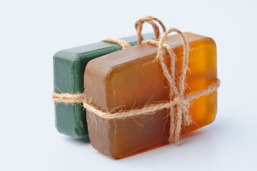Natural soap bars tied with ribbon isolated on white background