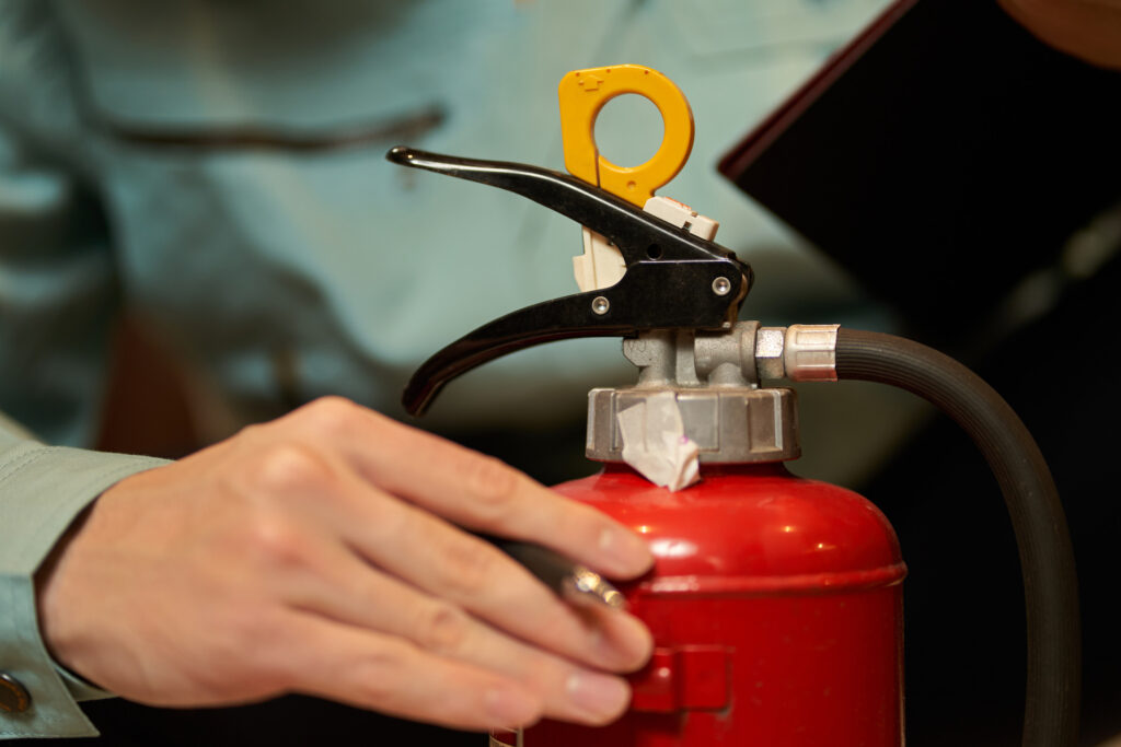 Asian man inspecting restaurant equipment