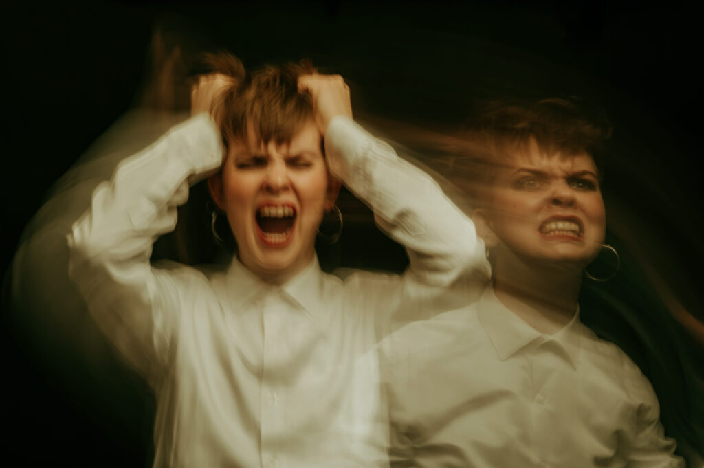 woman is psychopath with schizophrenia and mental disorders. Abstract blurry portrait of a girl with psychosis and panic attacks