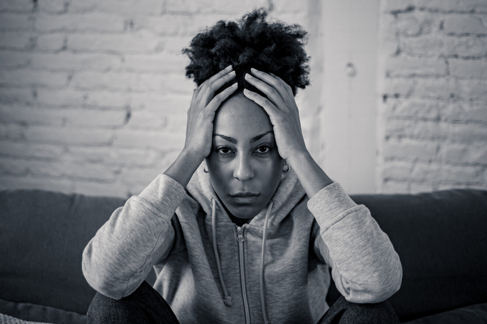 Young devastated depressed african american woman crying feeling sad, hurt suffering depression in sadness and emotional pain. Mental health in young people, bullying suicide and heartbroken concept.