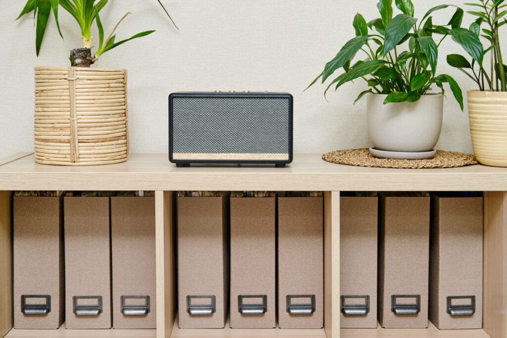 Acoustic music speaker in retro style. Vintage sound column in an old design