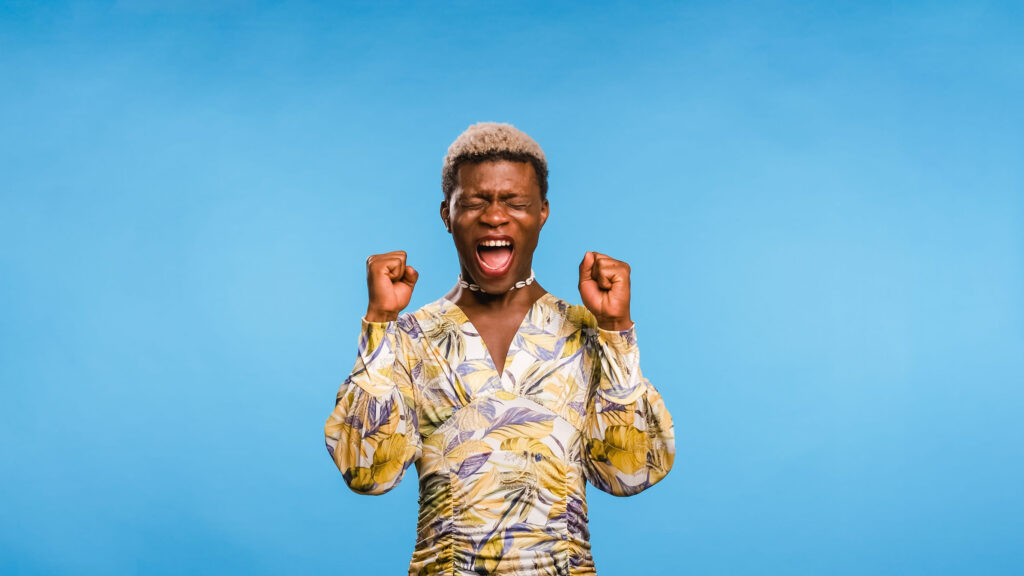 Black African model winner screaming on blue