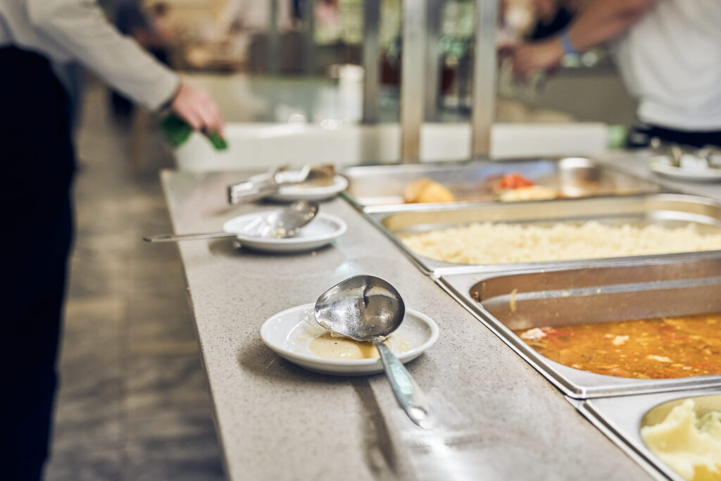 Buffet service at the hotel. There is a hot side dish in the containers. Offering self-service options, ideal for creating a copyspace image. High quality photo