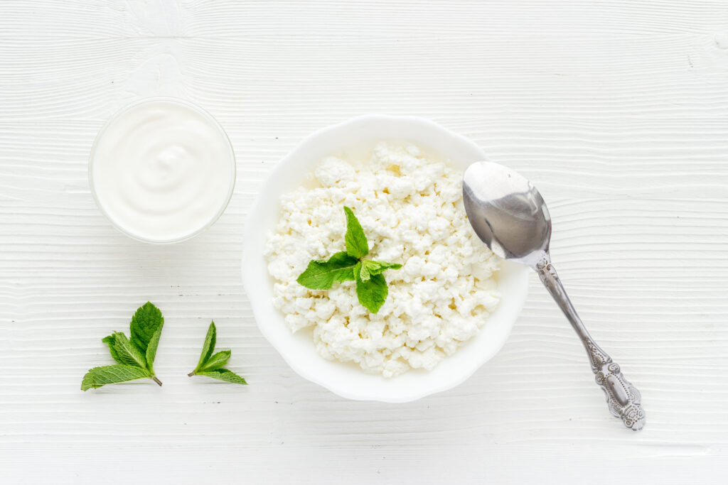 Farm cottage cheese in a bowl, top view. Healthy breakfast