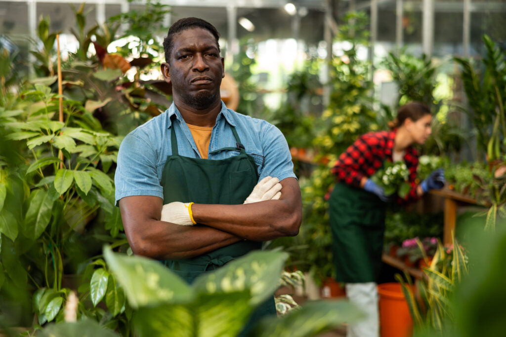 Portrait of professional florist in flower shop interior