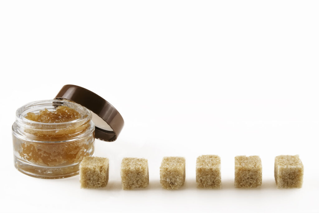 Body scrub with brown sugar crystals
