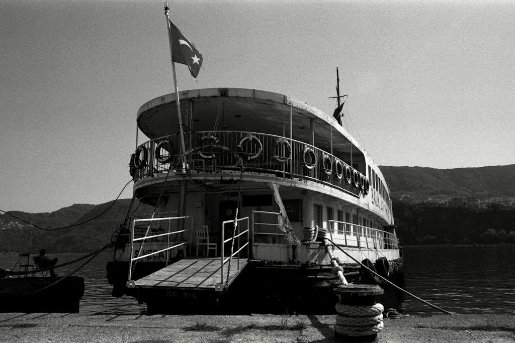 A classic vintage ferry docked at the harbor in Amasra, showcasing nostalgic charm.