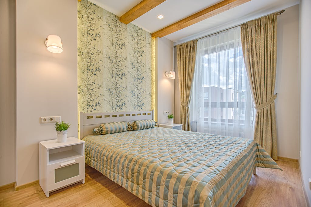 Your Home Looks Poor Because You Don't Know These 12 Decorating Tips 4 A luxurious and contemporary bedroom design with patterned wallpaper and natural lighting, located in Vilnius, Lithuania.