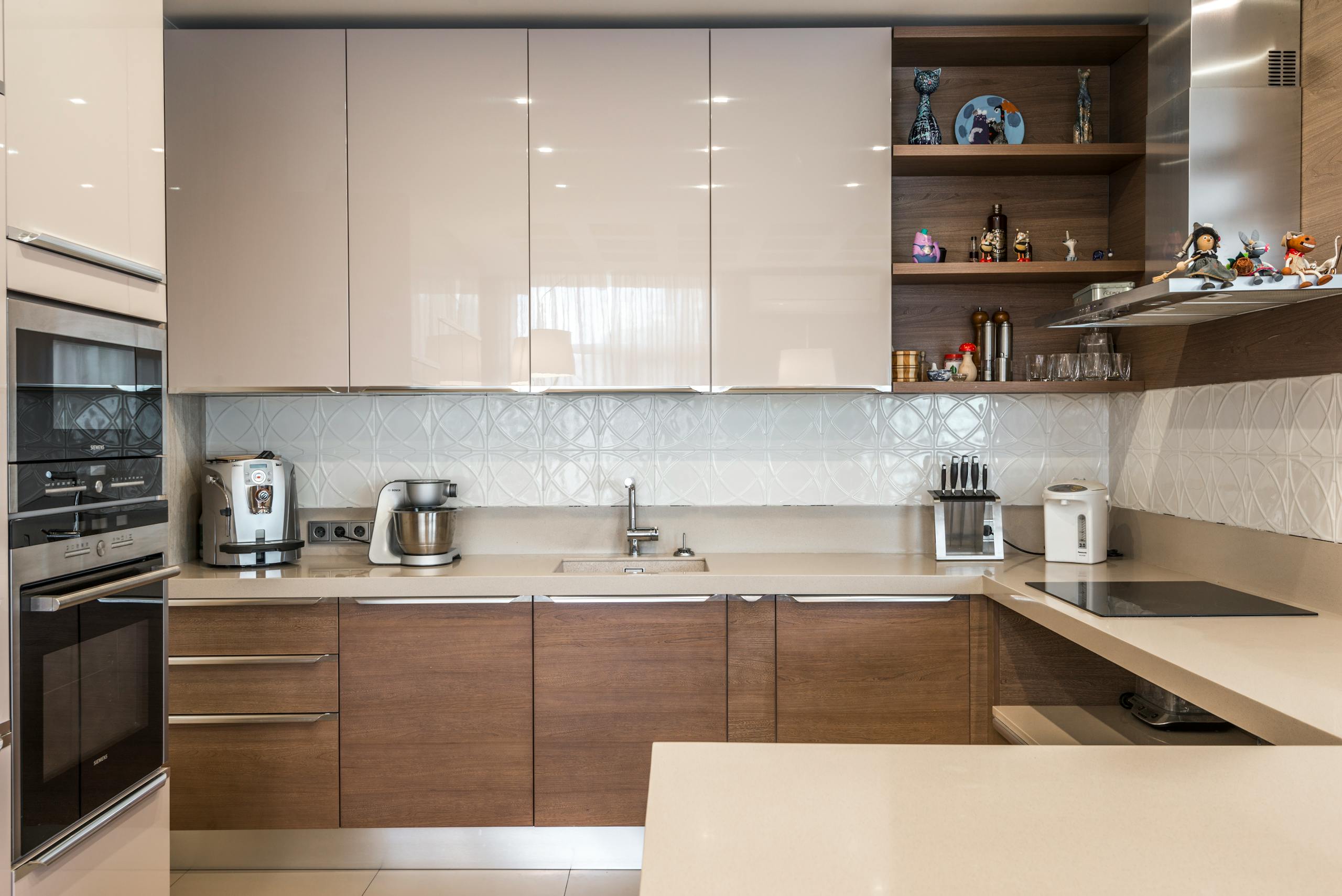 A sleek modern kitchen with contemporary cabinets and high-end appliances.