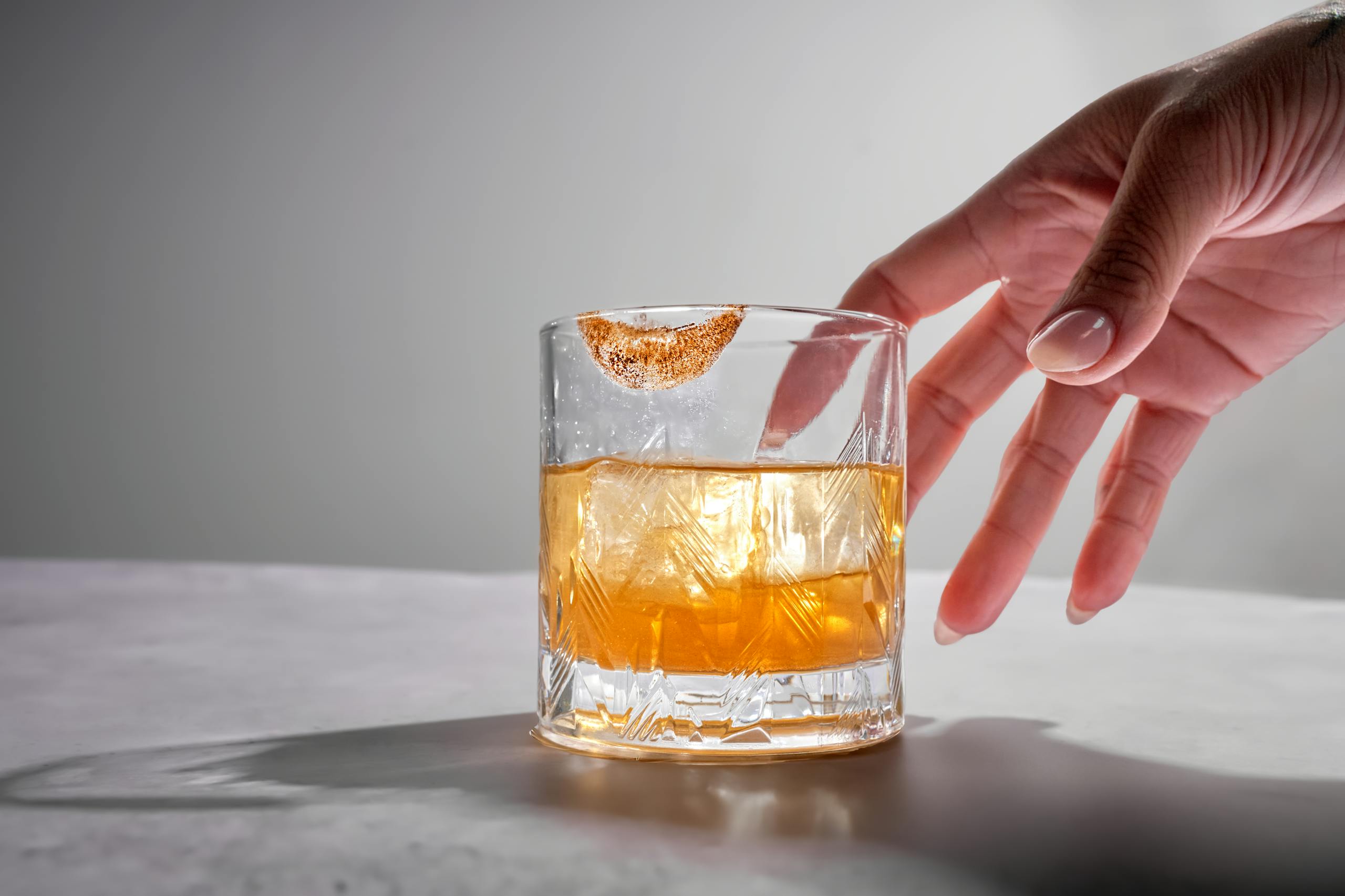 A stylish non-alcoholic drink in a glass with a citrus rim, perfect for refreshing enjoyment.