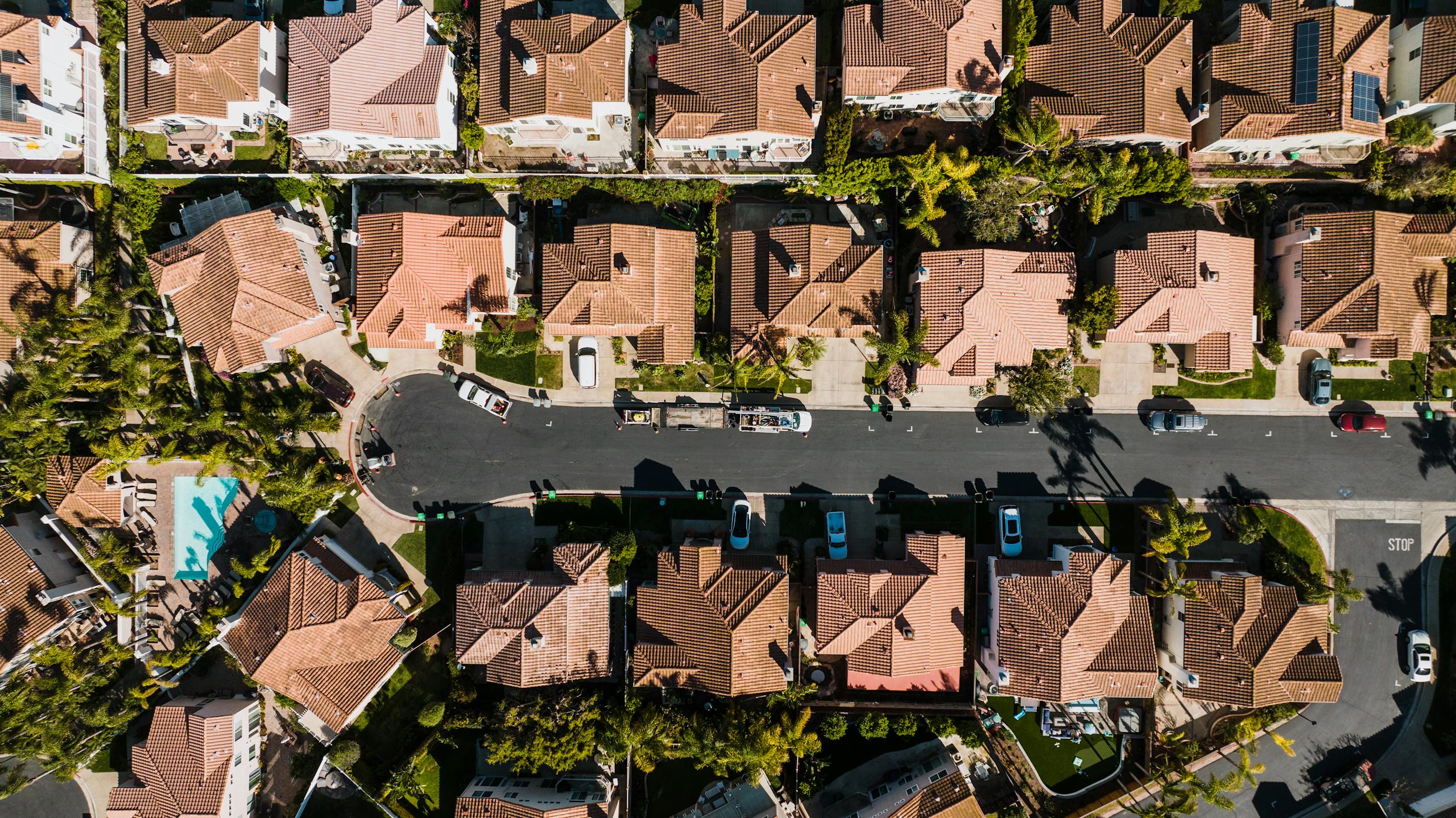 Aerial photograph showcasing a suburban neighborhood in Costa Mesa, CA, with neatly arranged houses and streets.