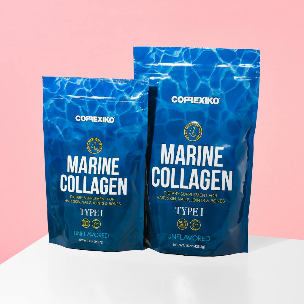 Close-up of marine collagen packaging on a pink background for health supplements.