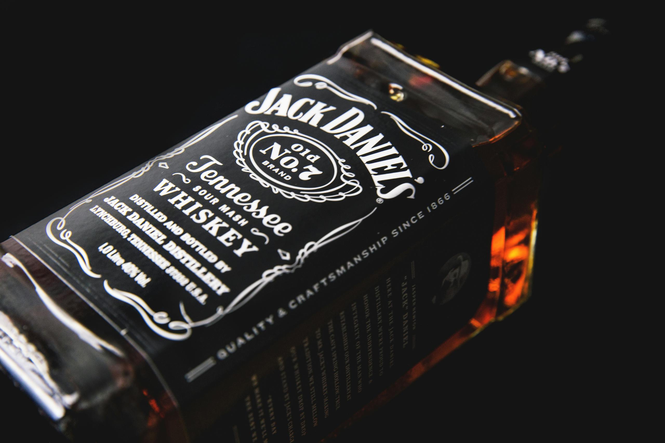 Detailed shot of a Jack Daniel's whiskey bottle, emphasizing classic design.