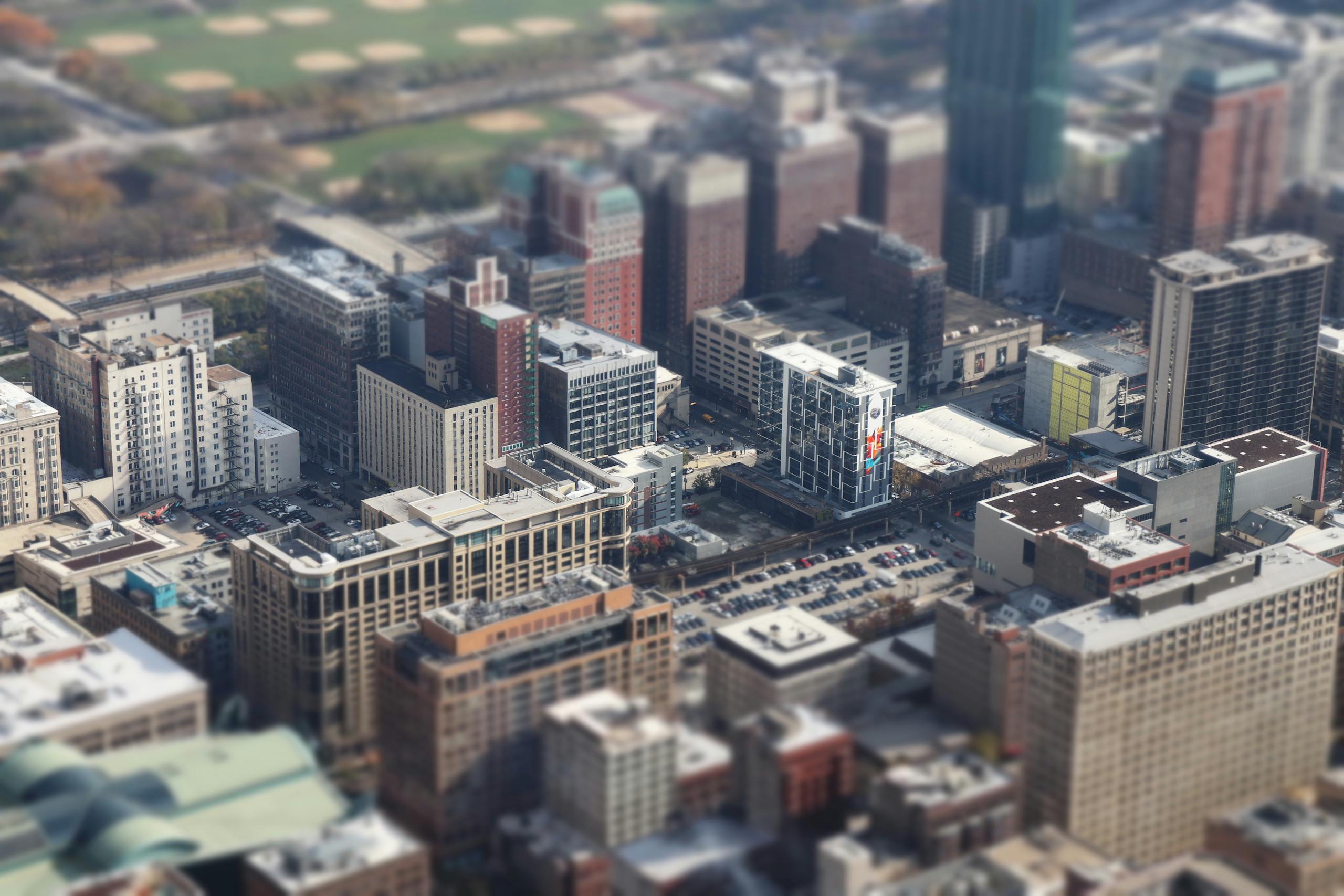 Discover Chicago's downtown in a tilt-shift aerial view, highlighting urban architecture and high-rise buildings.