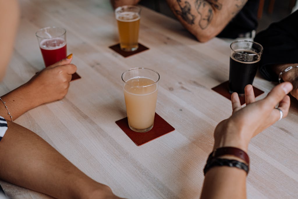 Friends enjoying a variety of craft beers at an indoor table setting.