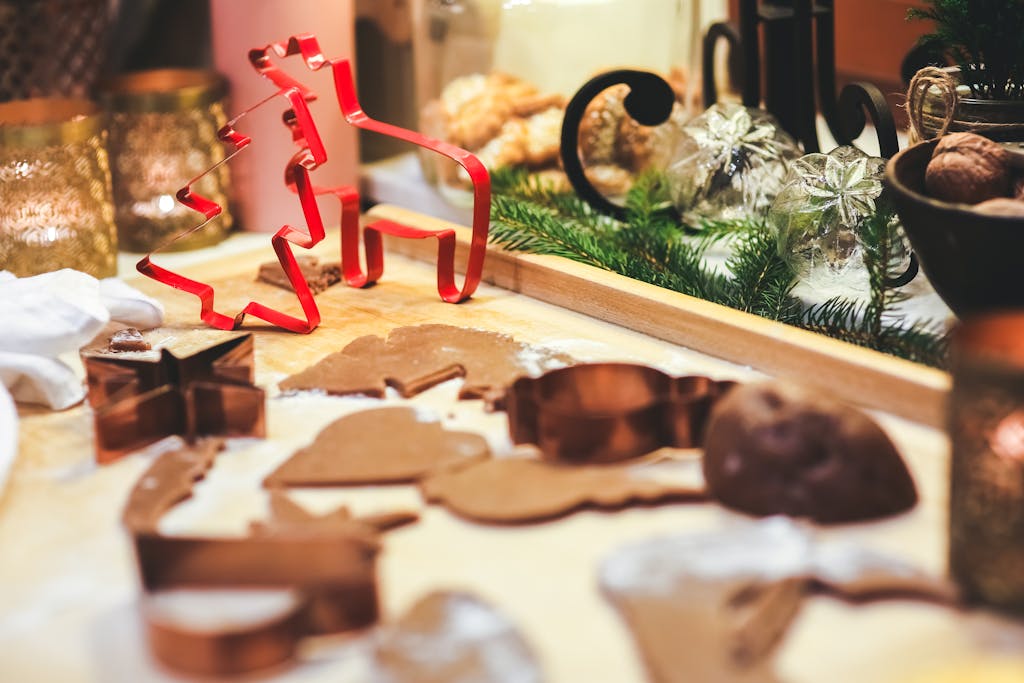 Joyful indoor scene of cookie baking with festive Christmas cutters, perfect for the holiday season.