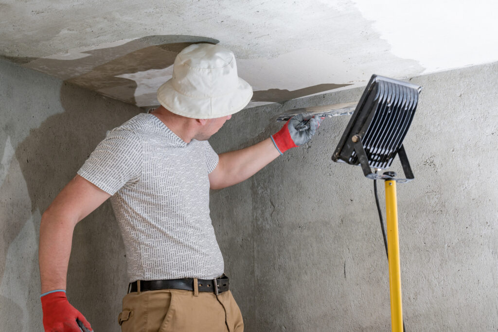 9 Home Maintenance Mistakes That Are Quietly Draining Your Wallet 4 medium vecteezy application of lime plaster on the ceiling repair work with 14272489 medium