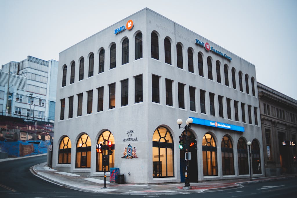 Modern exterior of Bank of Montreal building at twilight, showcasing urban architecture.