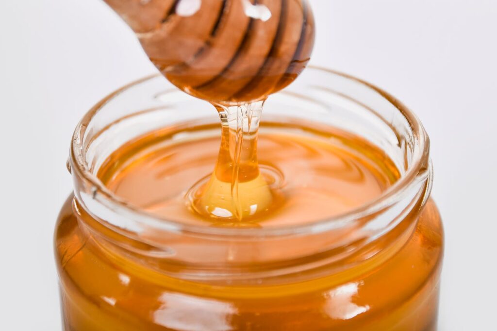 liquid-yellow-honey-in-a-glass-jar-