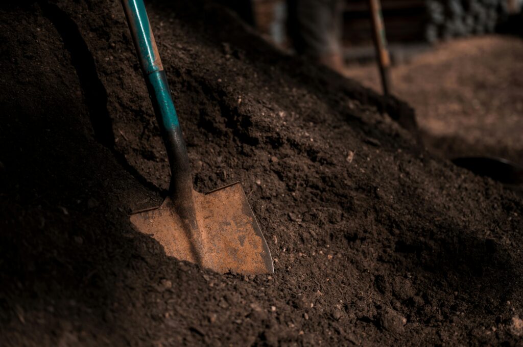 shovel-on-pile-of-soil-