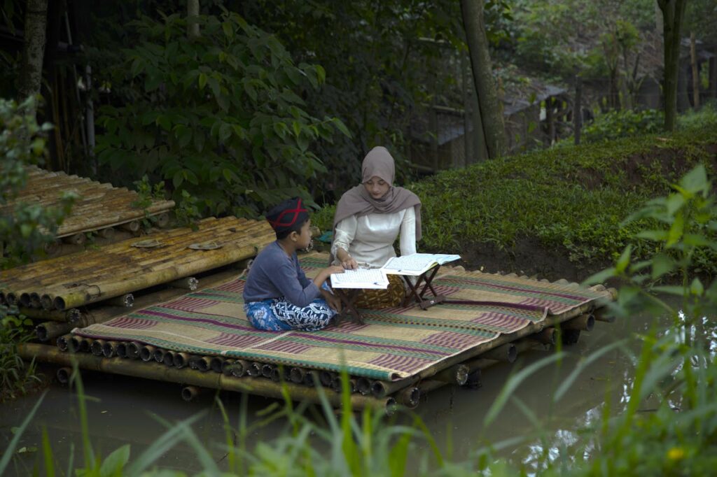 mother-and-son-studying-outdoors-in-bandung-
