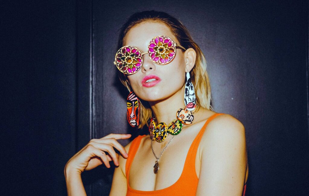 /a-woman-in-an-orange-tank-top-and-stylish-