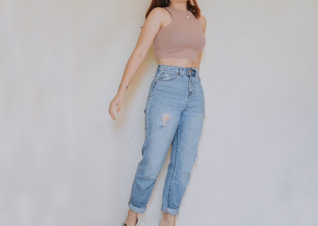 woman-in-brown-crop-top-and-denim-jeans