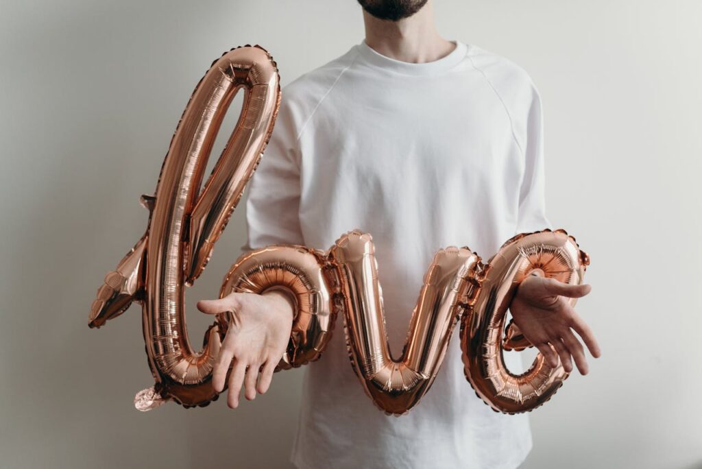 man-in-white-crew-neck-shirt-holding-brown-snake