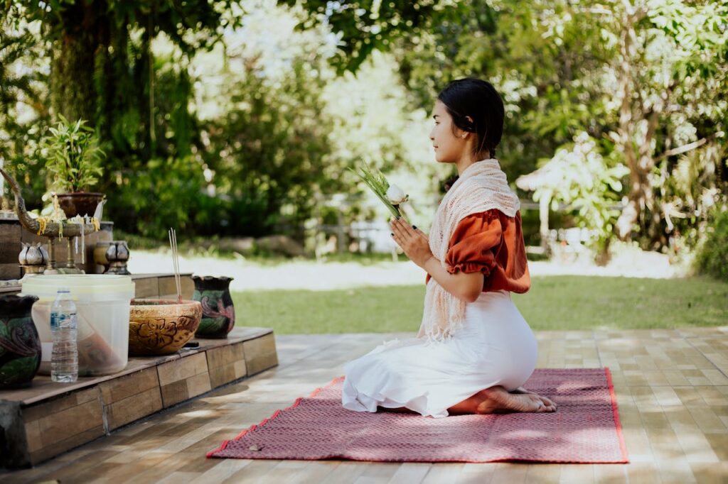-view-of-a-woman-praying-while-kneeling-