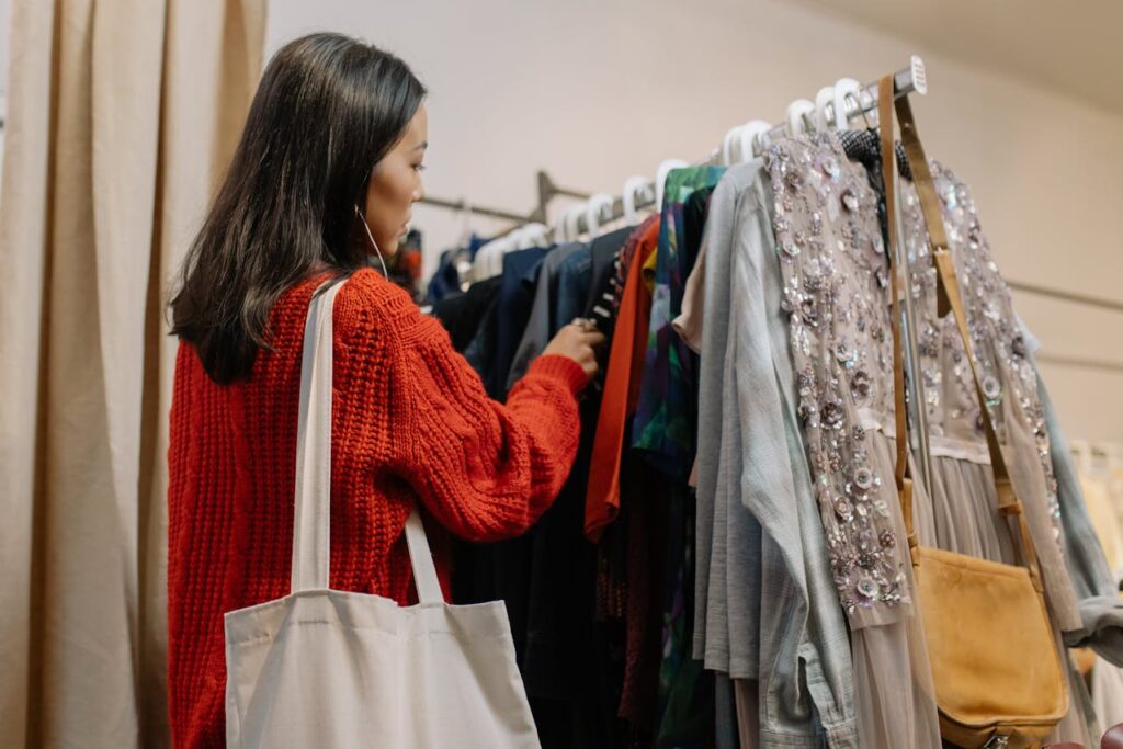 a-woman-shopping-for-clothes-in-a-thrift-store-