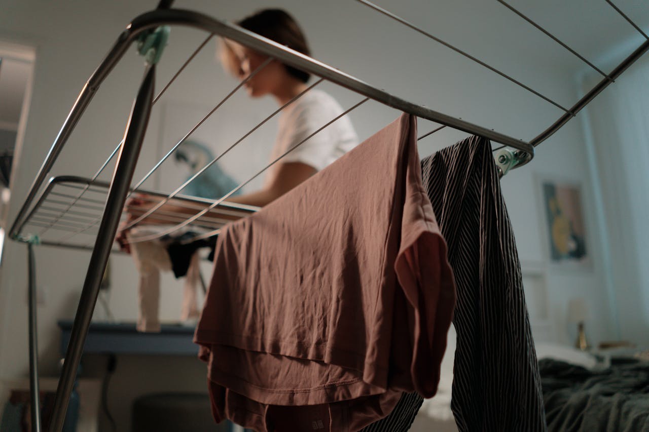 low-angle-shot-of-person-ironing-clothes-