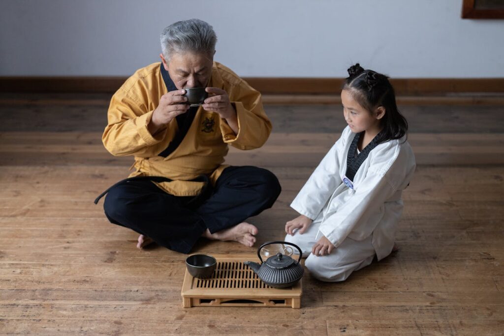 an-old-man-and-a-girl-having-a-tea-ceremony-