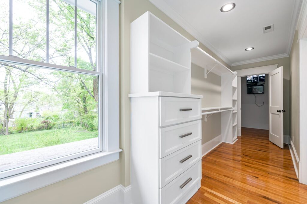 white-wooden-drawer-beside-a-window-