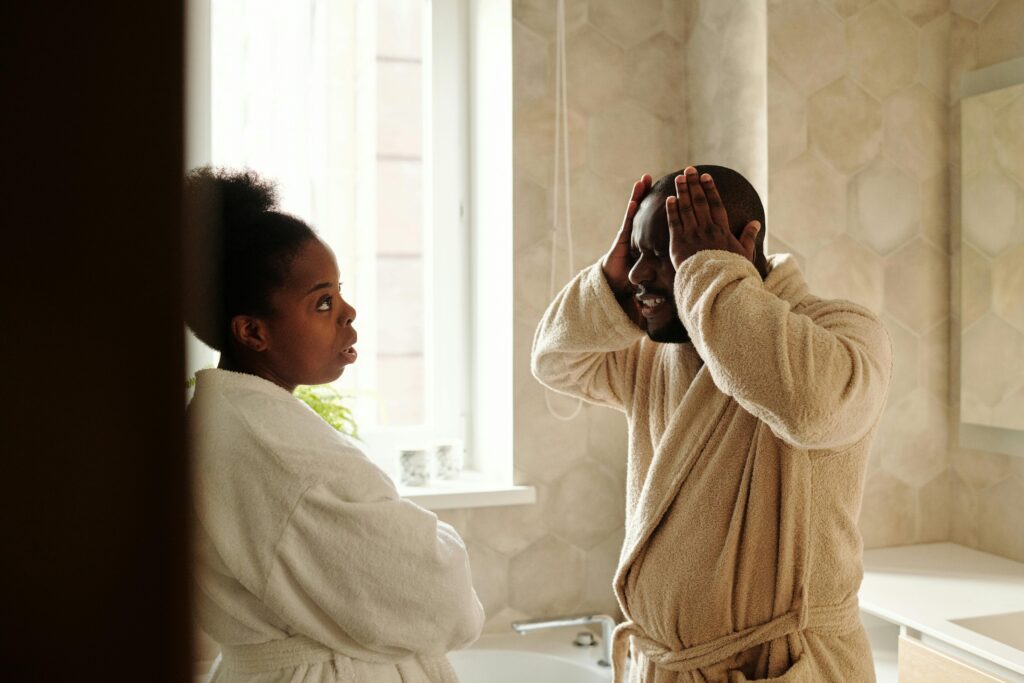 /couple-in-robes-arguing-
