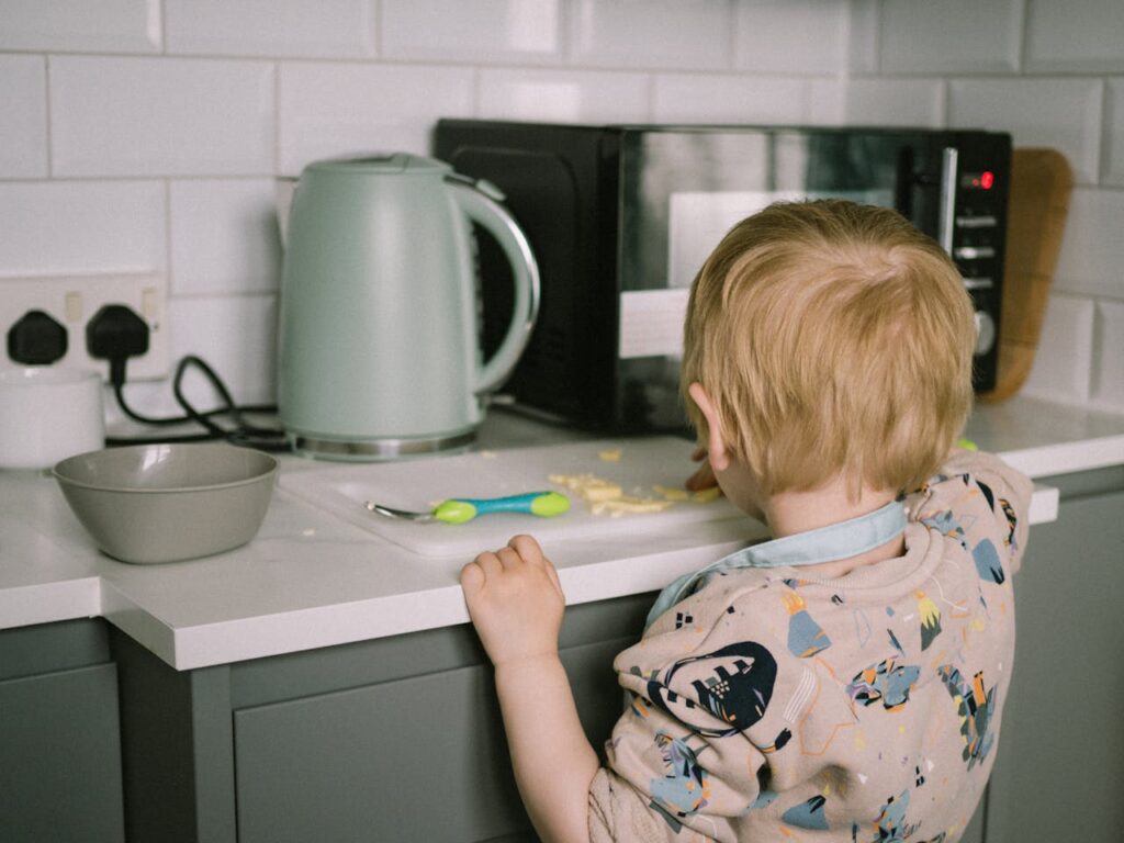 /child-eating-food-at-kitchen-counter
