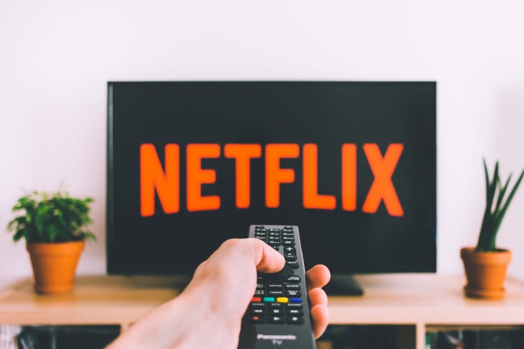 /person-holding-a-remote-control-