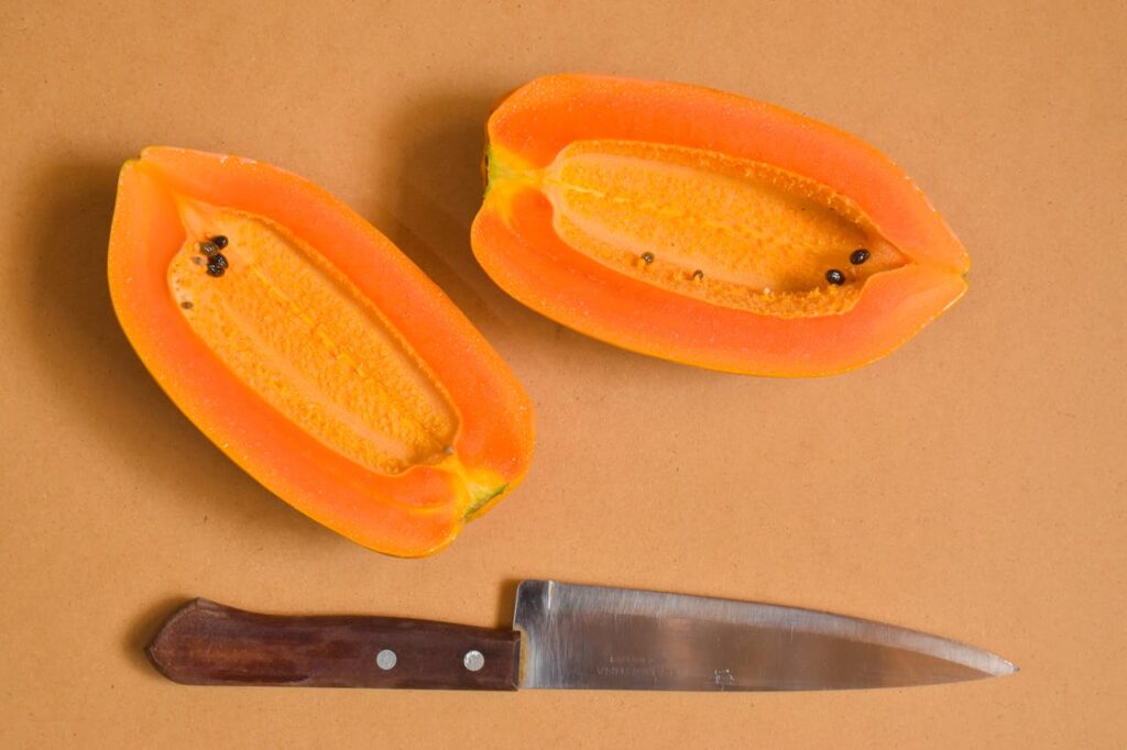 stainless-steel-knife-beside-sliced-fruit