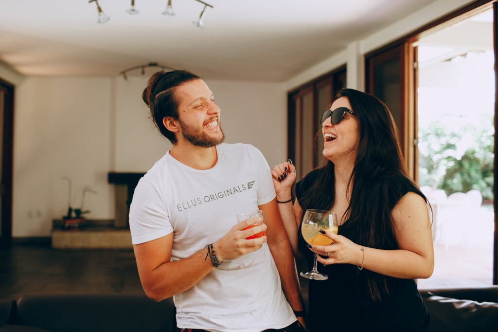 laughing-young-couple-having-fun-in-living-room-