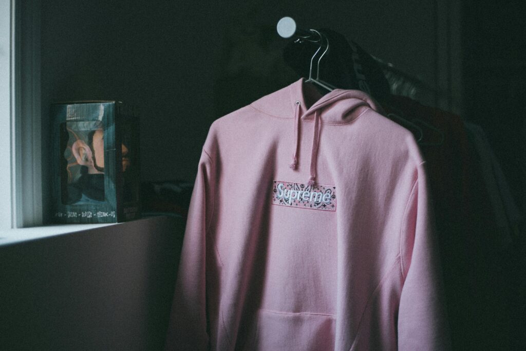 /pink-hoodie-on-clothes-rack-