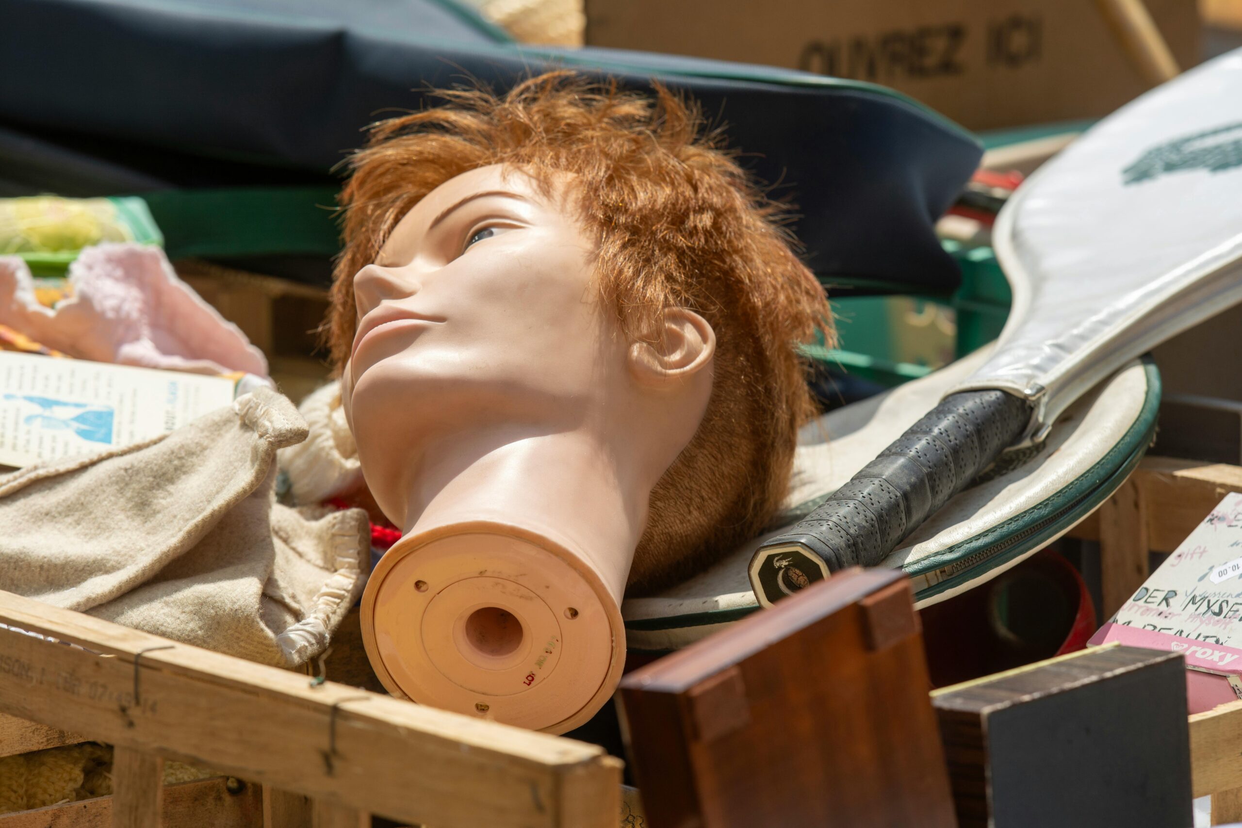 head-of-a-mannequin-and-a-tennis-racket