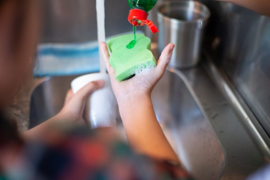 pouring-liquid-soap-on-a-sponge-